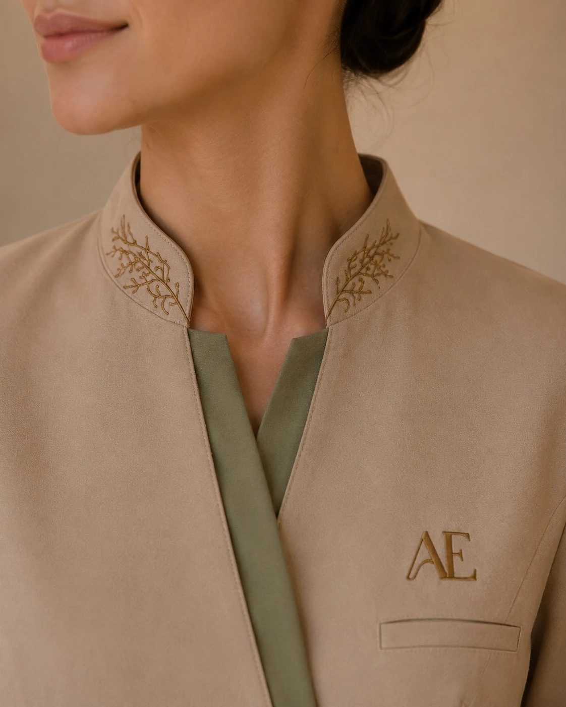 Aeterna Clinic medical branding embroidered uniform with AE monogram
