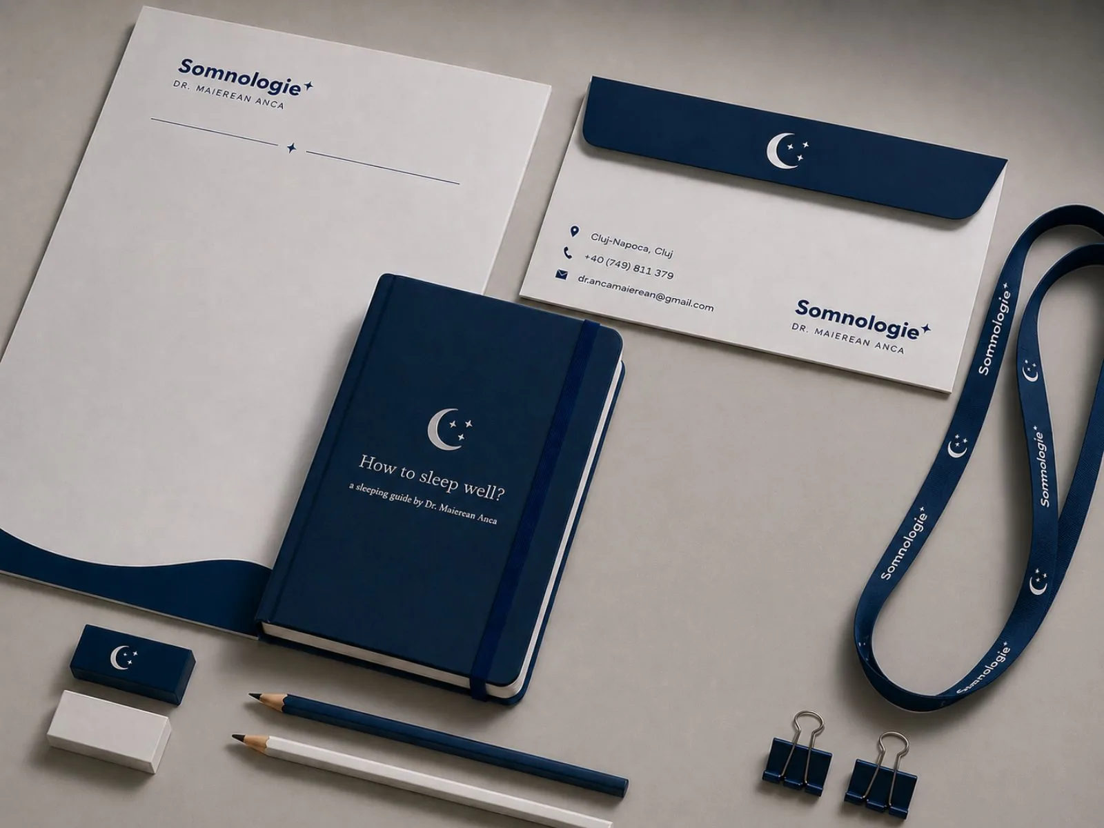 Somnologie Dr. Anca Maierean branded stationery flat lay with notebook and envelope
