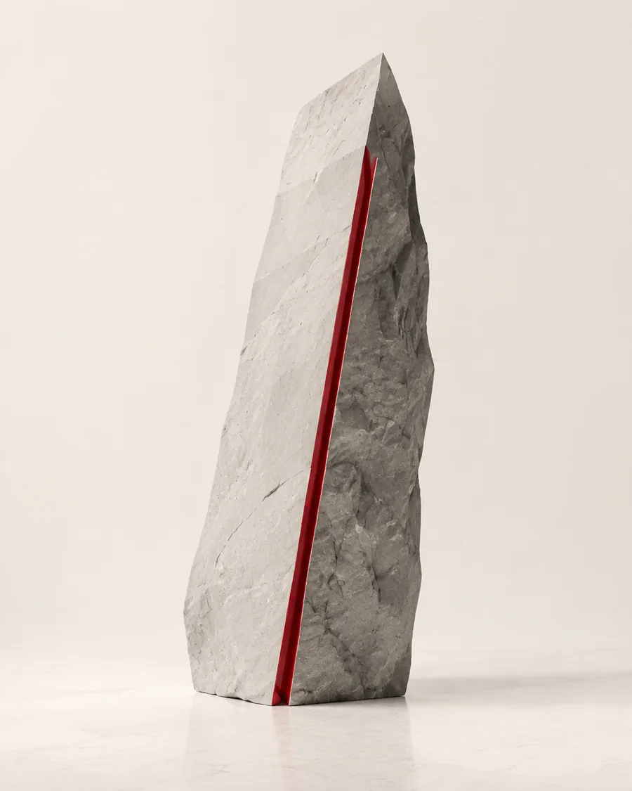 Stone monolith with a bright red incision representing distinctive brand positioning